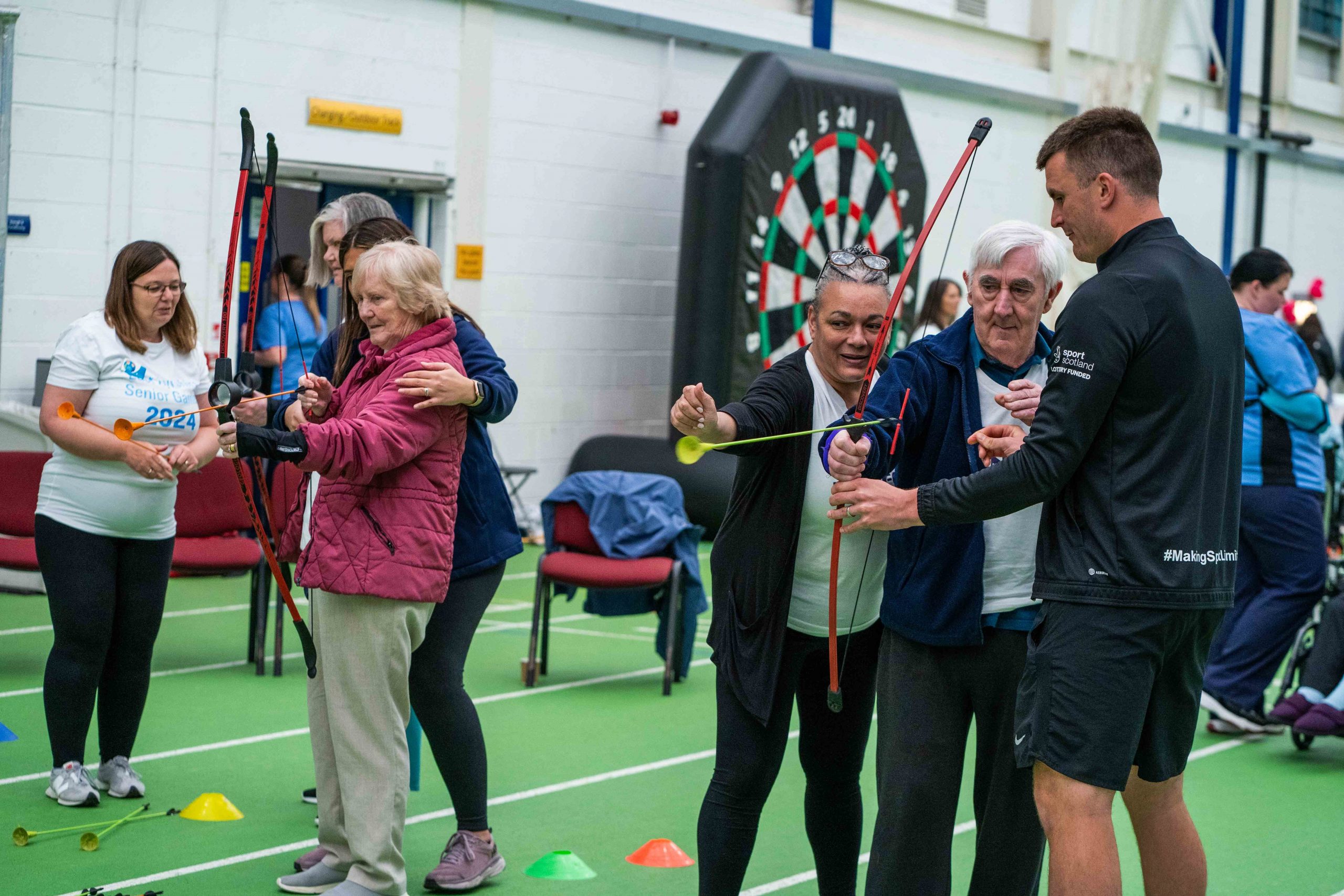 Attendees enjoying some archery at the recent Senior Games