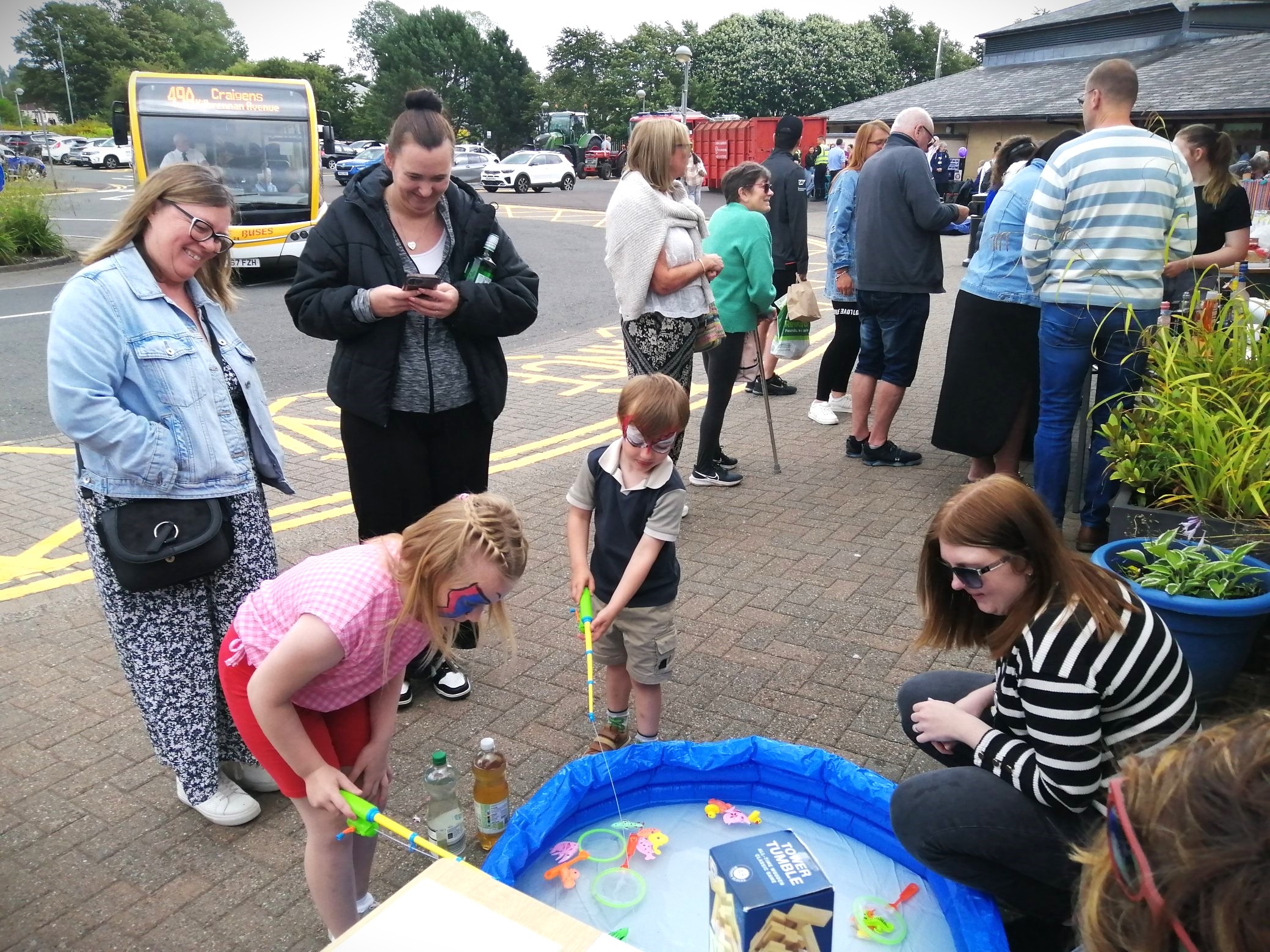 Children, families and hospital visitors enjoying games and activities outside East Ayrshire Community Hospital