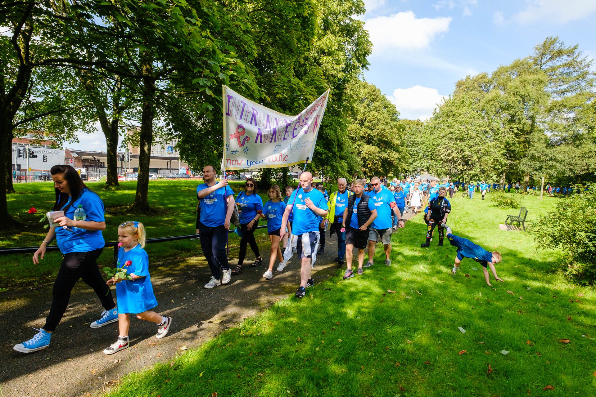 Participants taking part in a walk to raise awareness during International Overdose Awareness Day