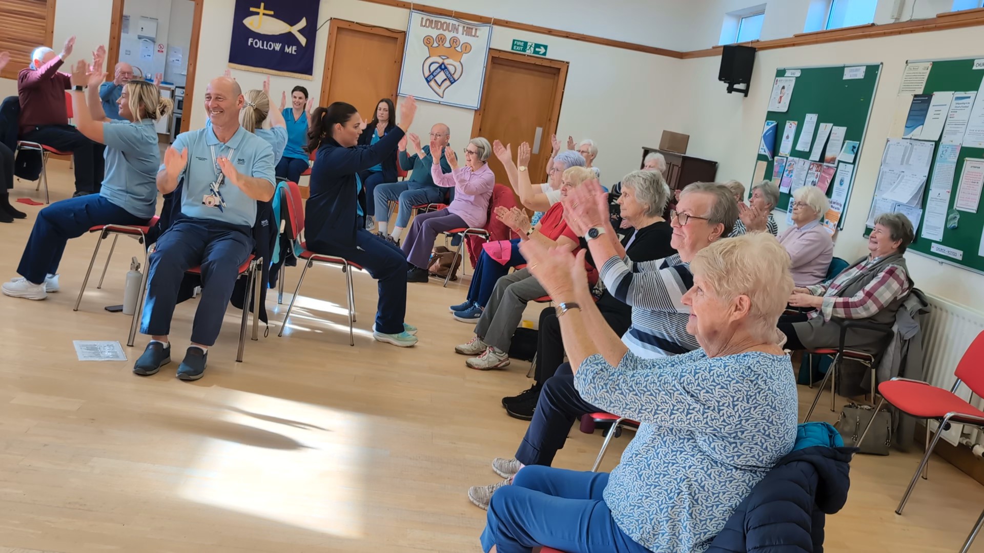 Attendees enjoying some seated exercises at the class